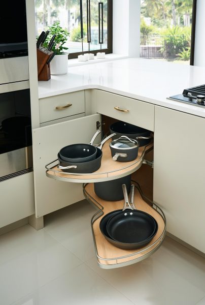 https://www.designcraftcabinets.com/wp-content/uploads/2019/02/Blind-Corner-Base-with-Pull-Out-Storage3-404x600.jpg